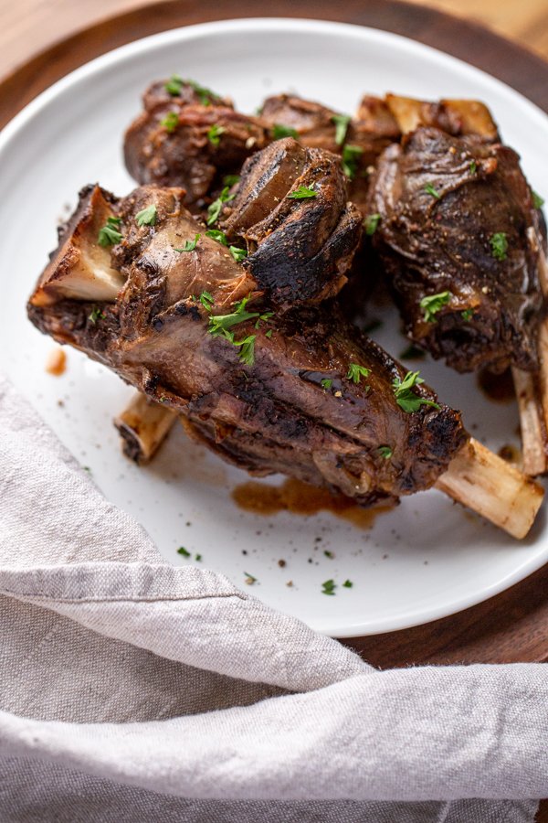 venison shanks on a white place