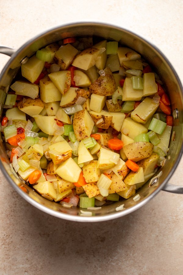 potatoes and veggies cooking in a pot