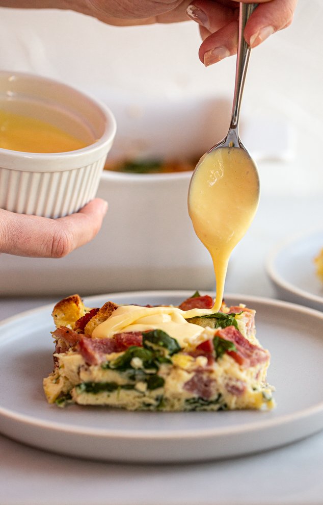 blender sauce being poured over an egg bake