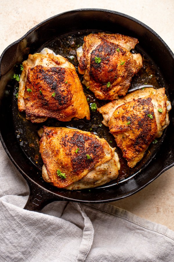 pan roasted chicken thighs in a pan