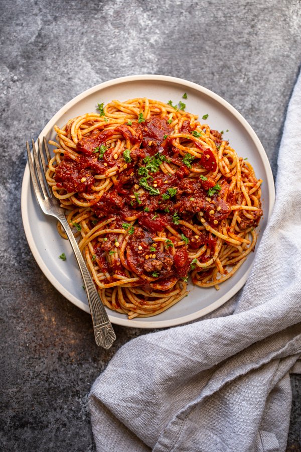 venison bolognese on a blue plate