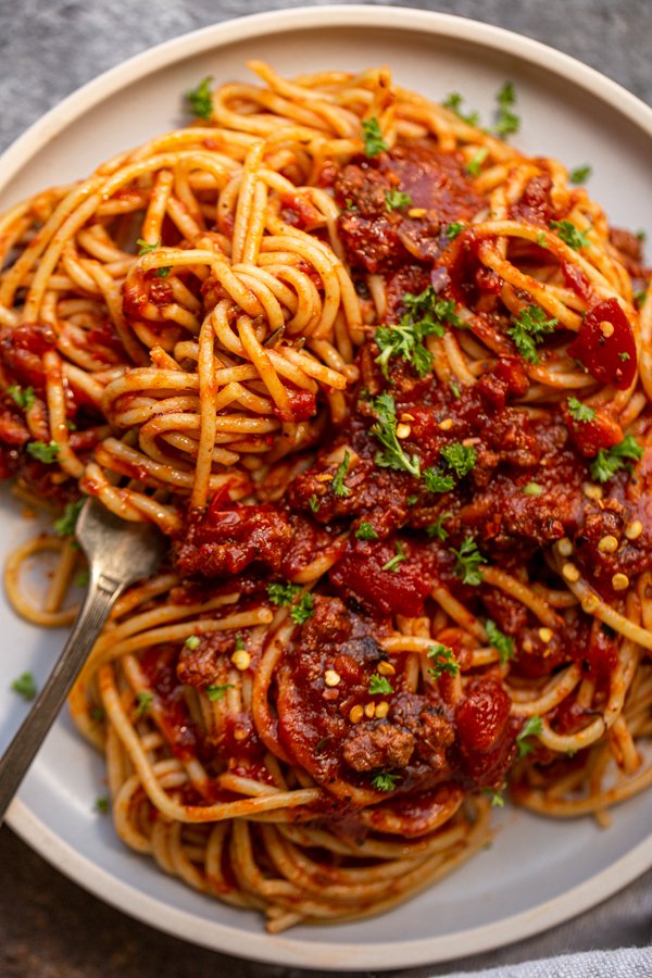 venison bolognese on a blue plate