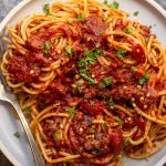 venison bolognese on a blue plate