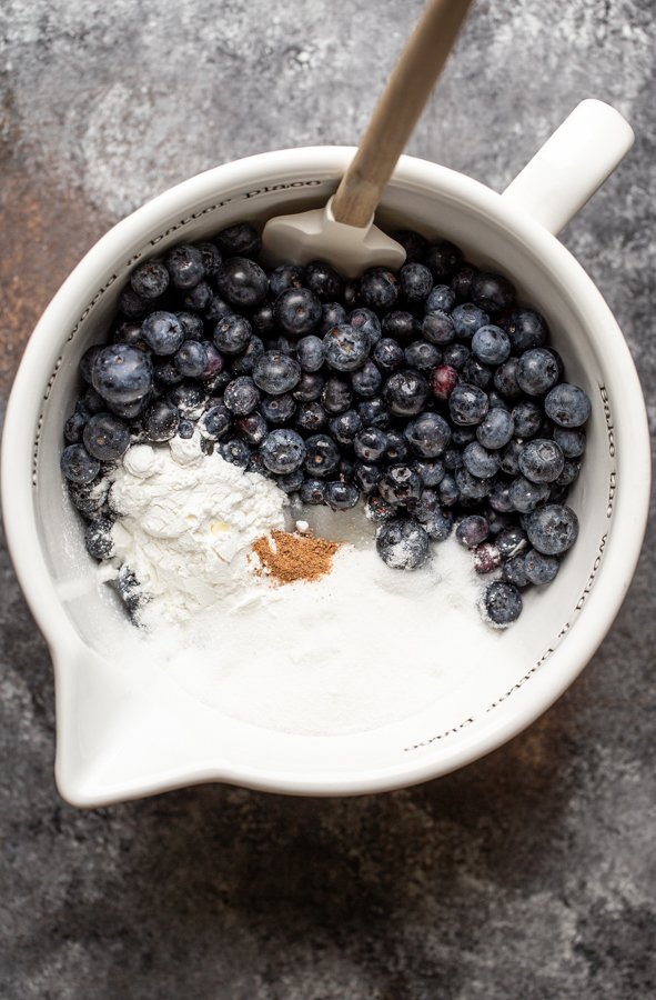 blueberries, sugar and nutmeg in a bowl