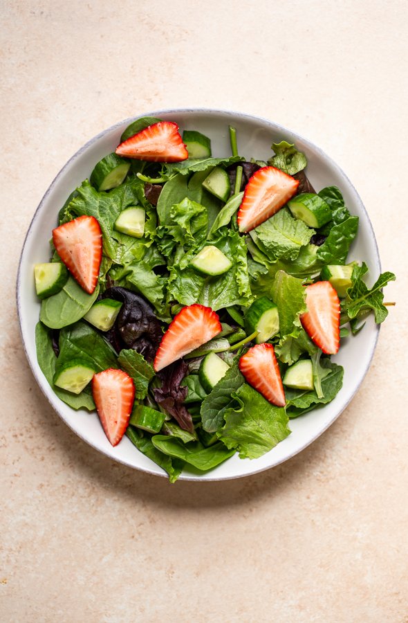 salad in a bowl cucumber and strawberries