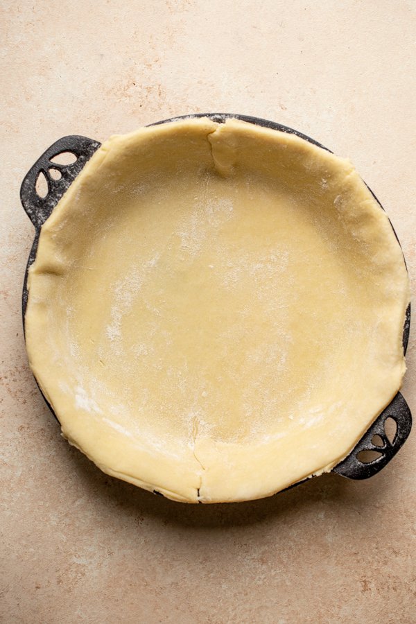 pie crust in a cast iron pie plate