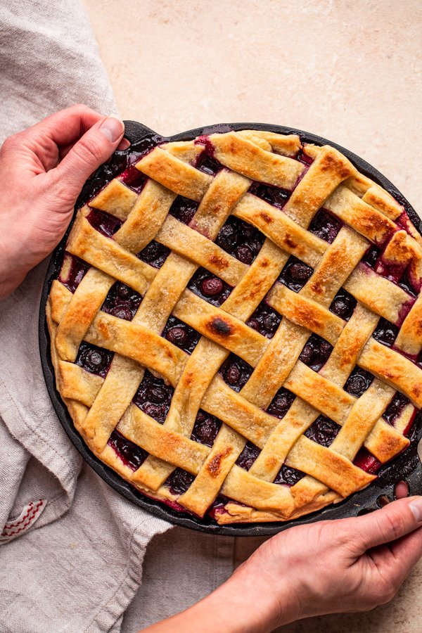 traeger pie with blueberries in a cast iron pie plate