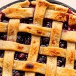 traeger pie with blueberries in a cast iron pie plate