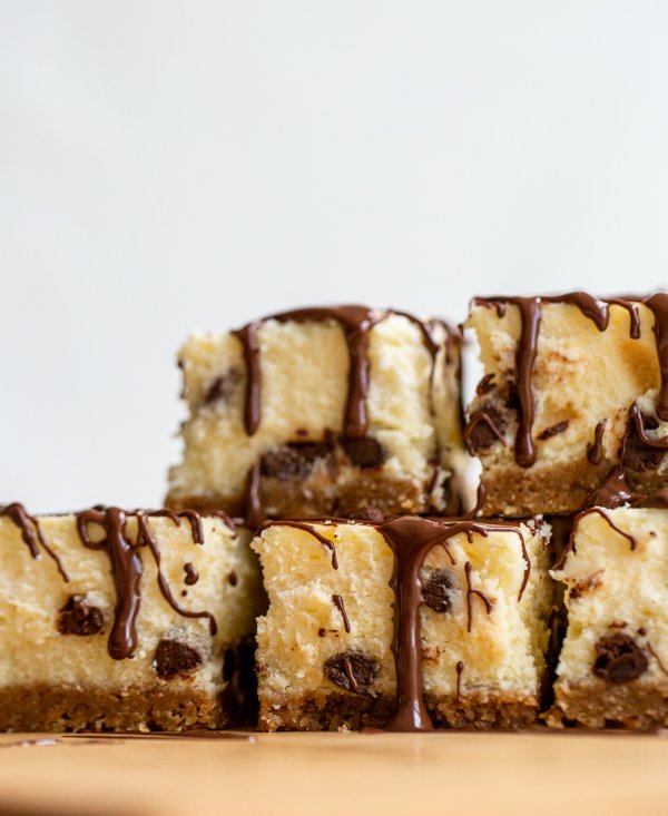 a stack of chocolate chip cheesecake bars