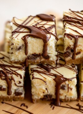 a stack of chocolate chip cheesecake bars