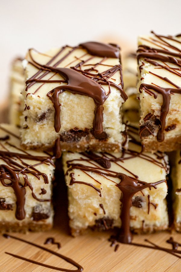 a stack of chocolate chip cheesecake bars