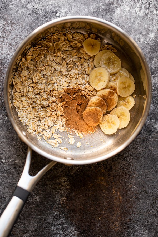 oats, cinnamon and banana in a saucepan