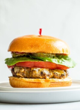 venison burger on a white plate