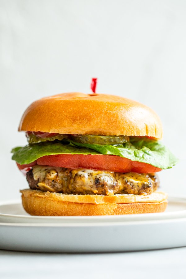 venison burger on a white plate