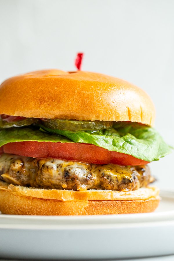 venison burger on a white plate