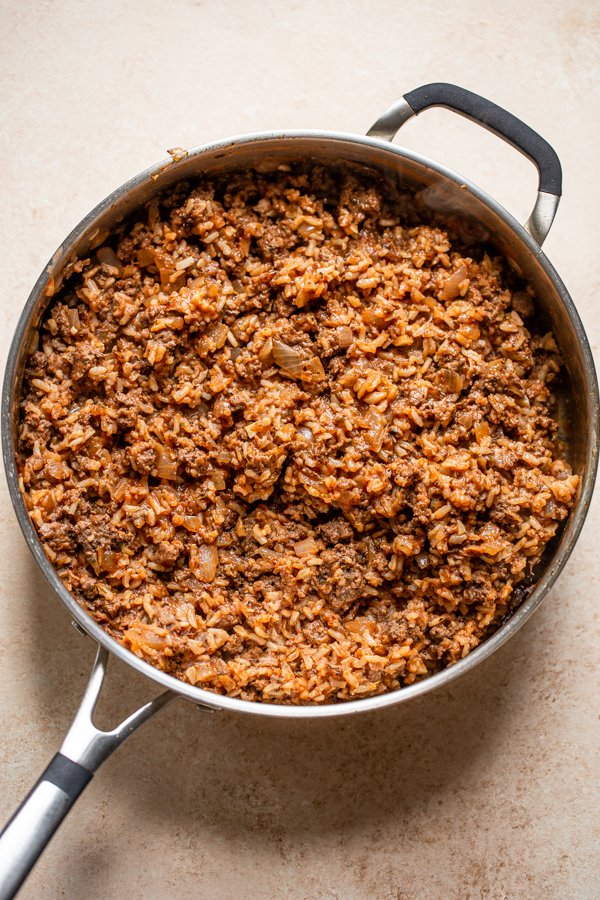 ground venison with rice in a skillet