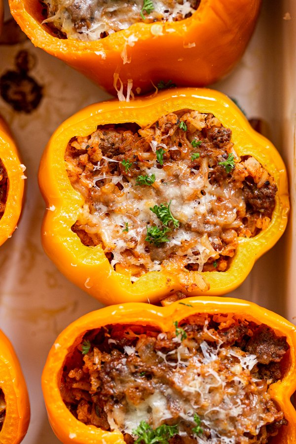 venison stuffed peppers in a white baking dish