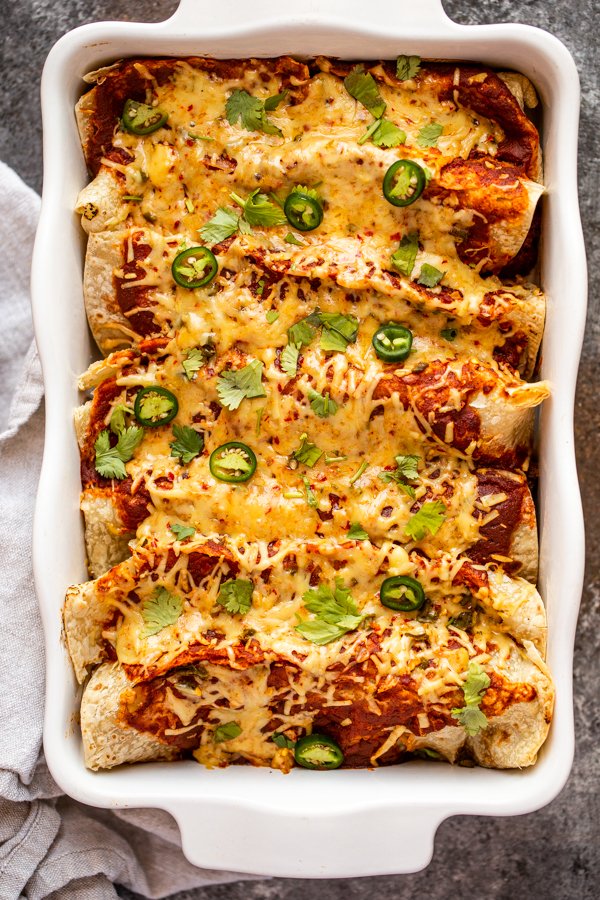 venison enchiladas in a white baking dish