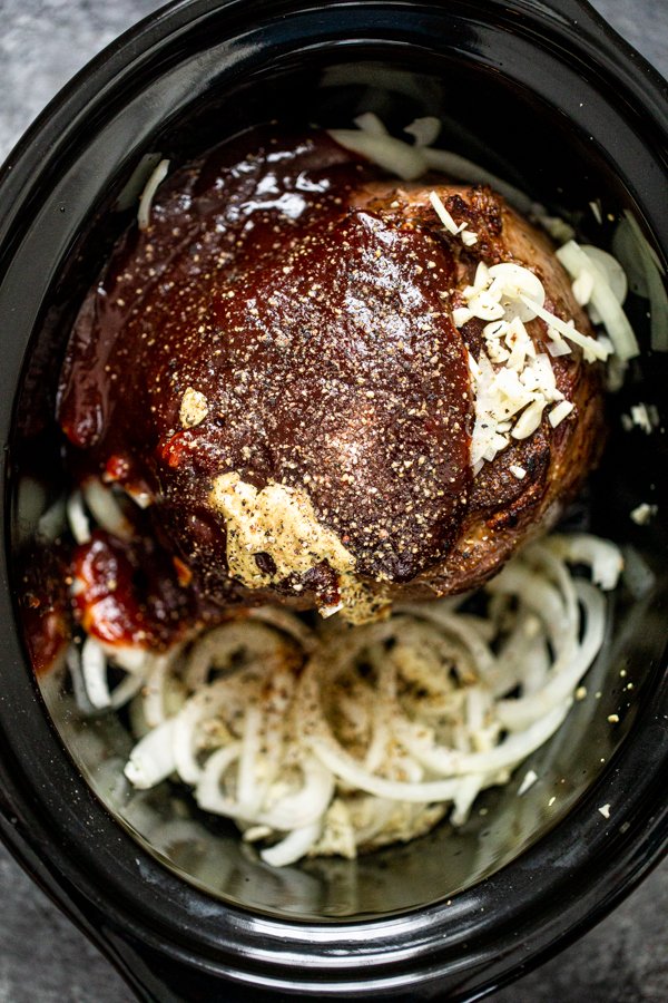 all of the ingredients for BBQ venison in a slow cooker