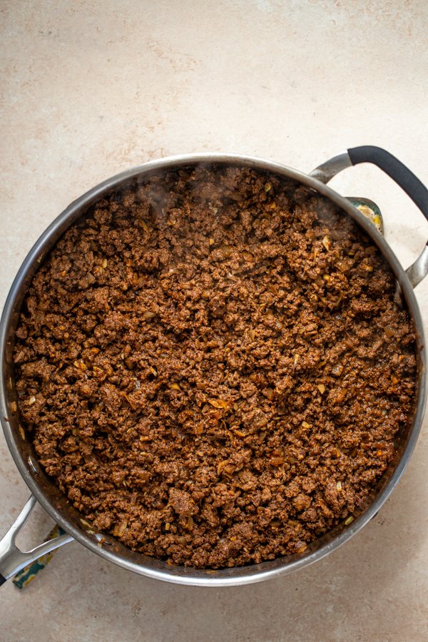 ground venison with spices cooking in a pan