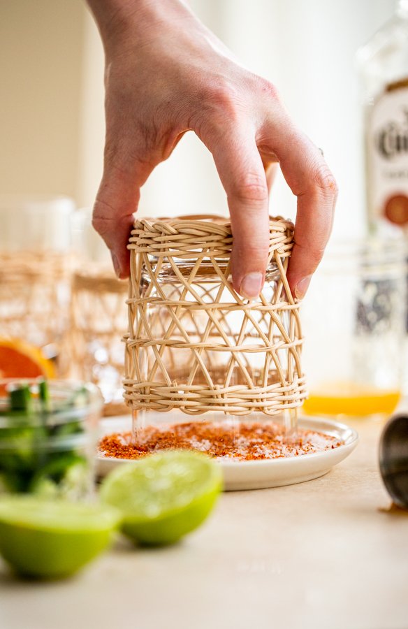 dipping a glass in salt and spices to rim the glass