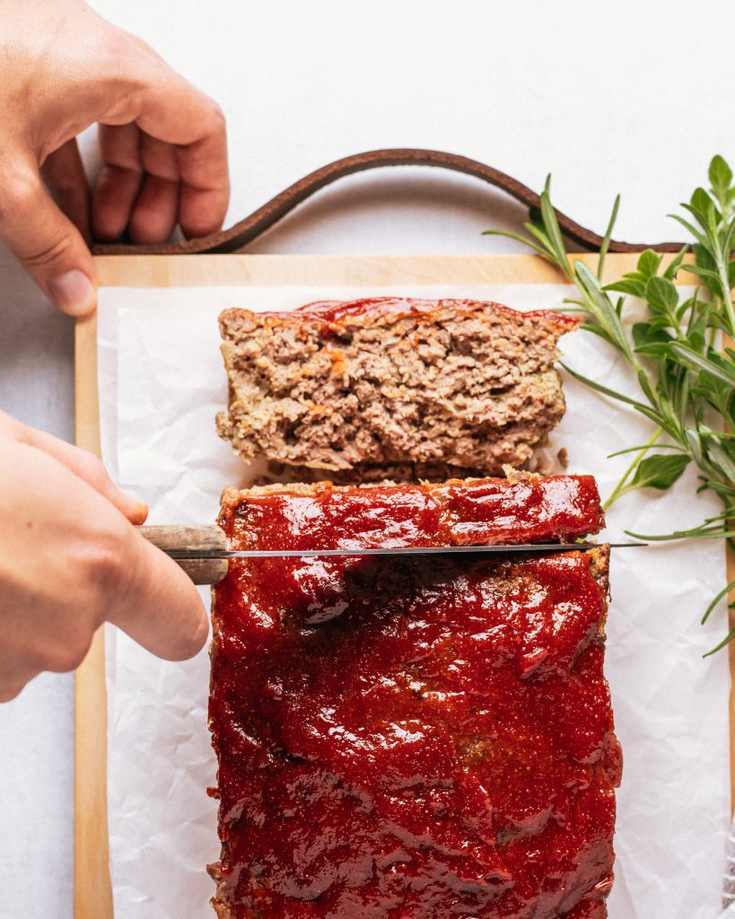 slicing the venison meatloaf