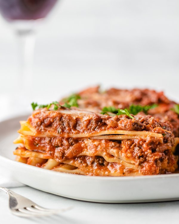 a slice of venison lasagna on a white plate