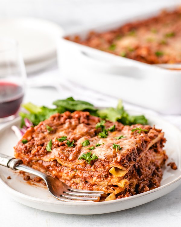 a slice of venison lasagna on a white plate