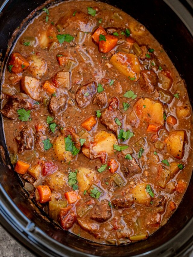 slow cooker venison stew in the crockpot with carrots and potatoes