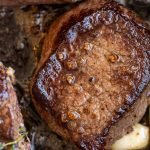 venison soaked in buttermilk in a cast iron pan