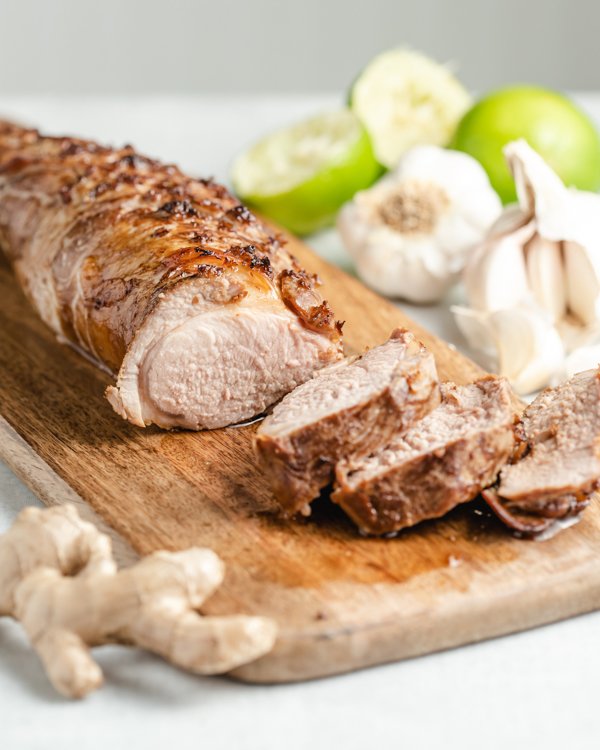 honey garlic pork tenderloin on a wood cutting board