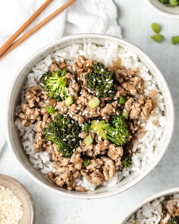 sticky ground pork rice bowls in a white bowl on a counter