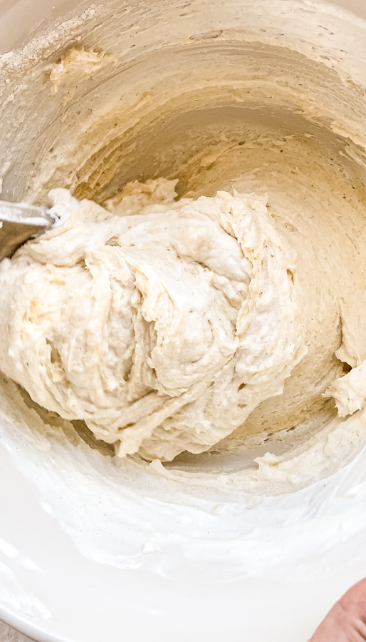 fluffy coffee cake batter being mixed in a bowl
