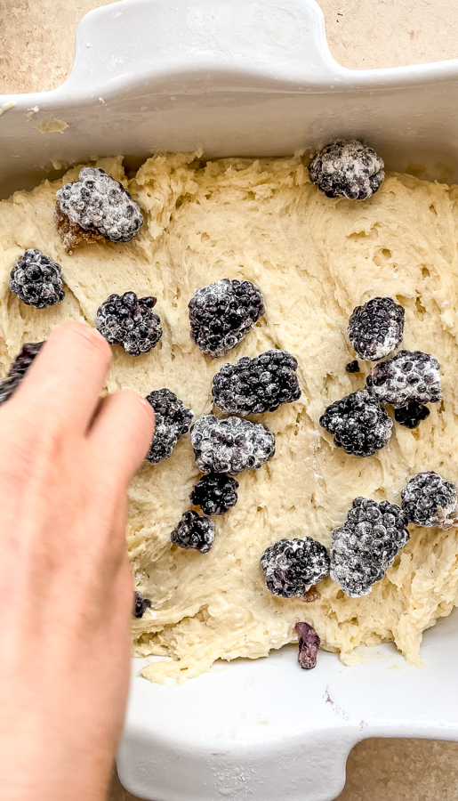 blackberries over coffee cake batter in a baking dish