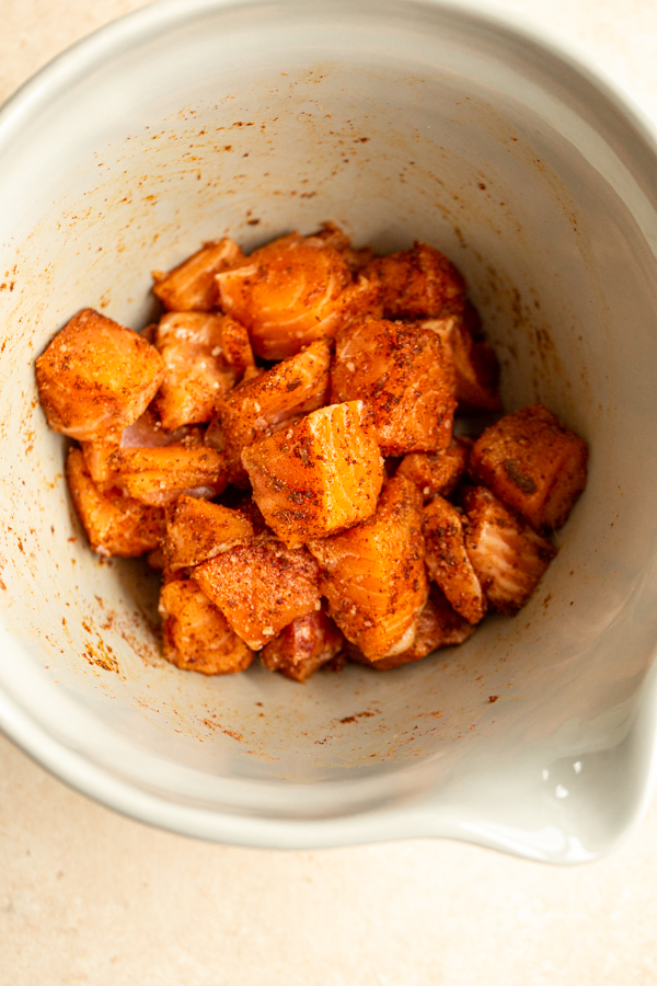 cubed, raw salmon in a bowl