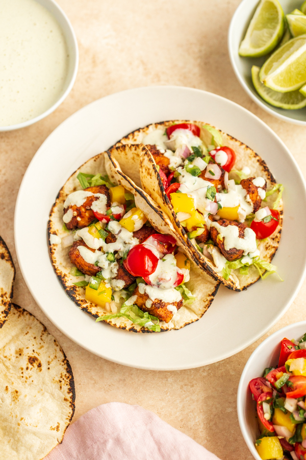 air fryer salmon tacos on a plate in a tortilla