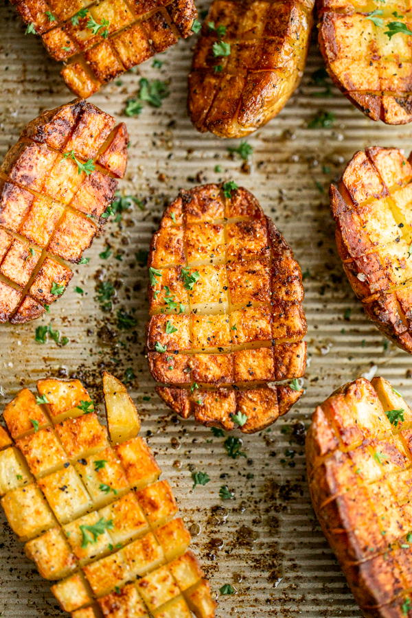 scored potato halves with crosshatch cuts roasted in the oven until crispy