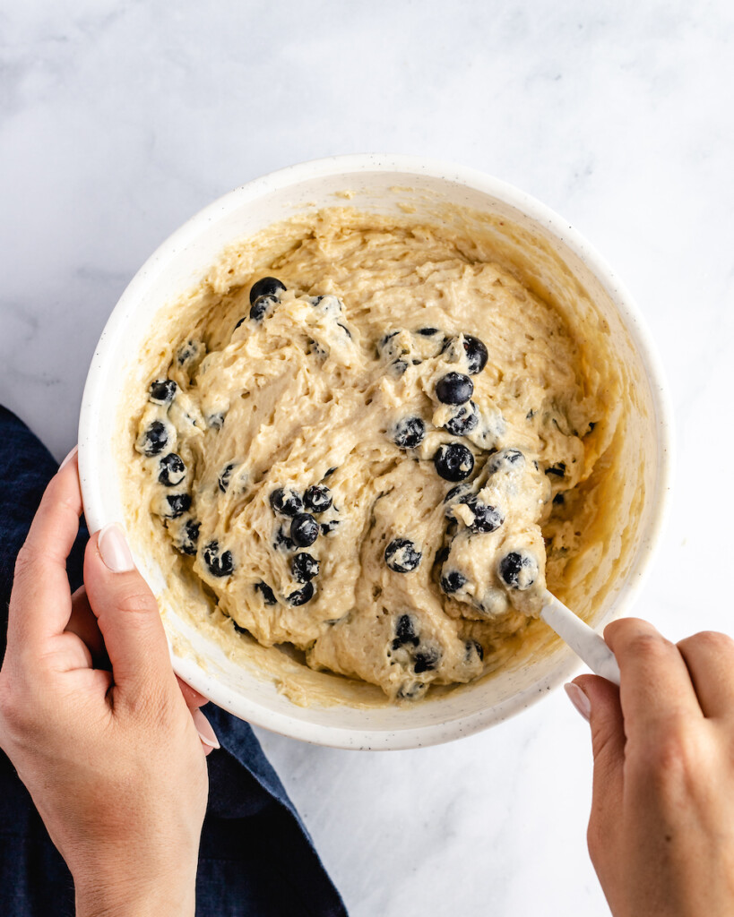 mixing up blueberry muffin batter