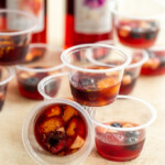 mini plastic cups filled wine sangria wine jello shots and fruit