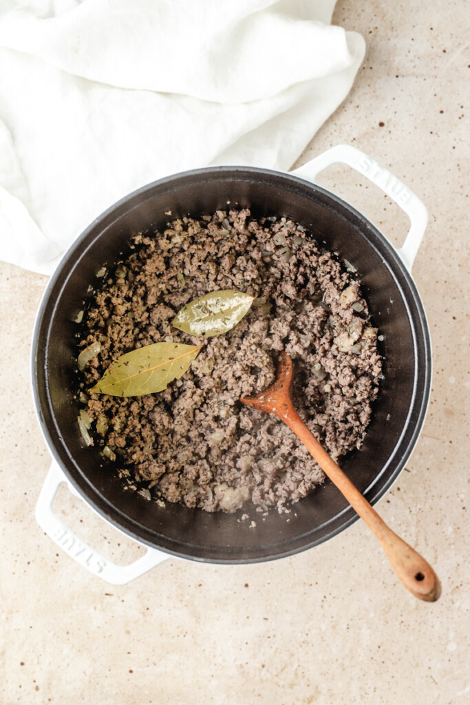 Ground Beef, Sausage, onion and seasonings cooked in large white pot