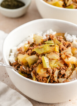 Cabbage Rolls in a Bowl served in a white bowl over white rice