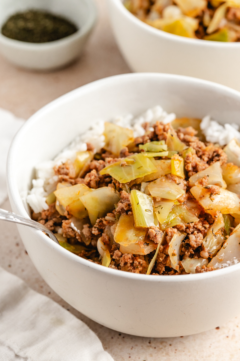 Cabbage Rolls in a Bowl served in a white bowl over white rice