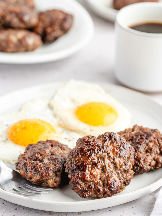 Venison Breakfast Sausage patties on white plate with eggs