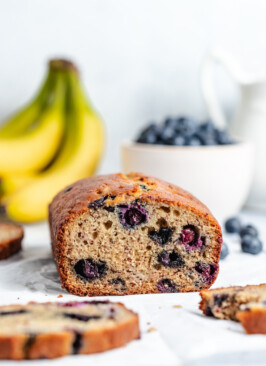 A cut loaf of Banana Blueberry Bread