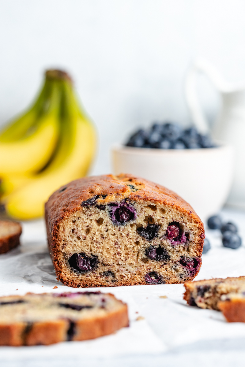 A cut loaf of Banana Blueberry Bread