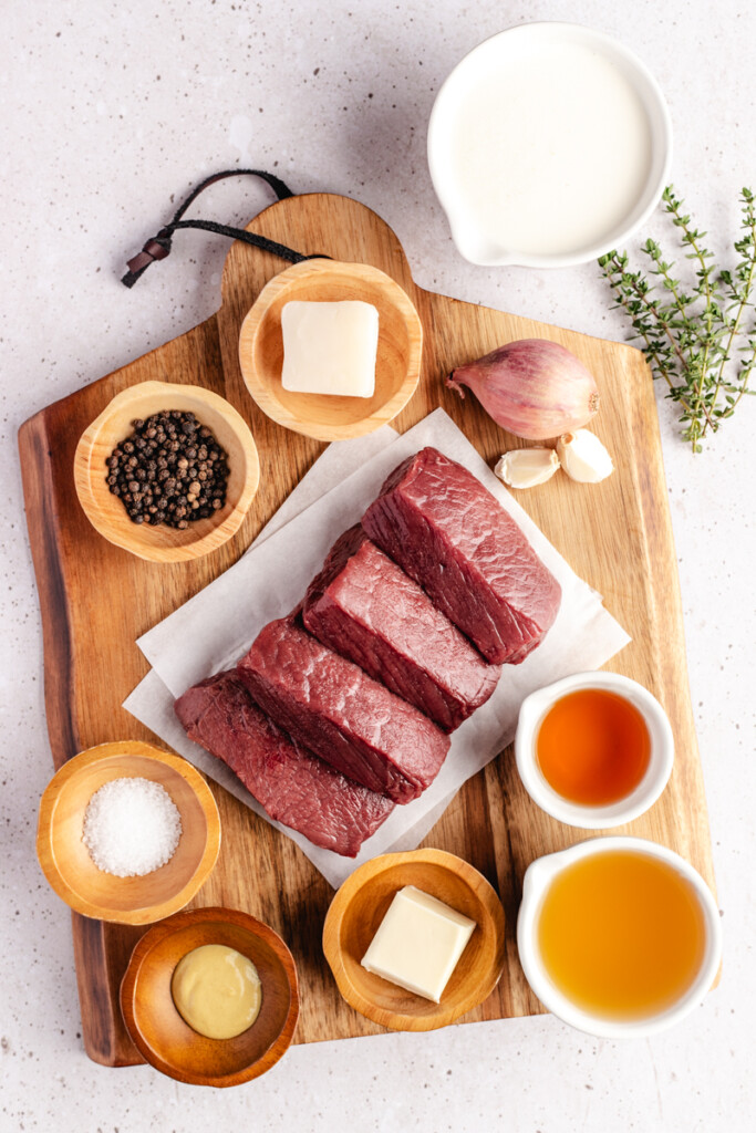 Ingredients to make Venison Au Poivre on a cutting board