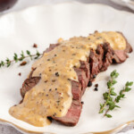 Venison Au Poivre served on a white plate
