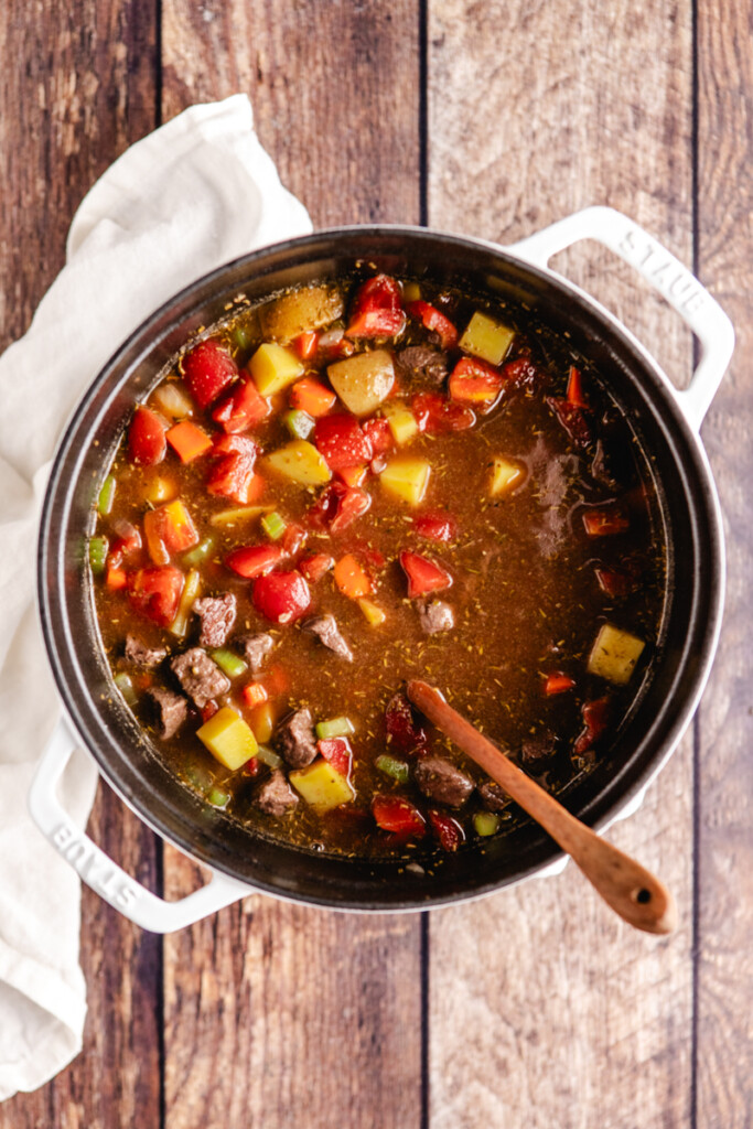 Venison stew ingredients in soup pot