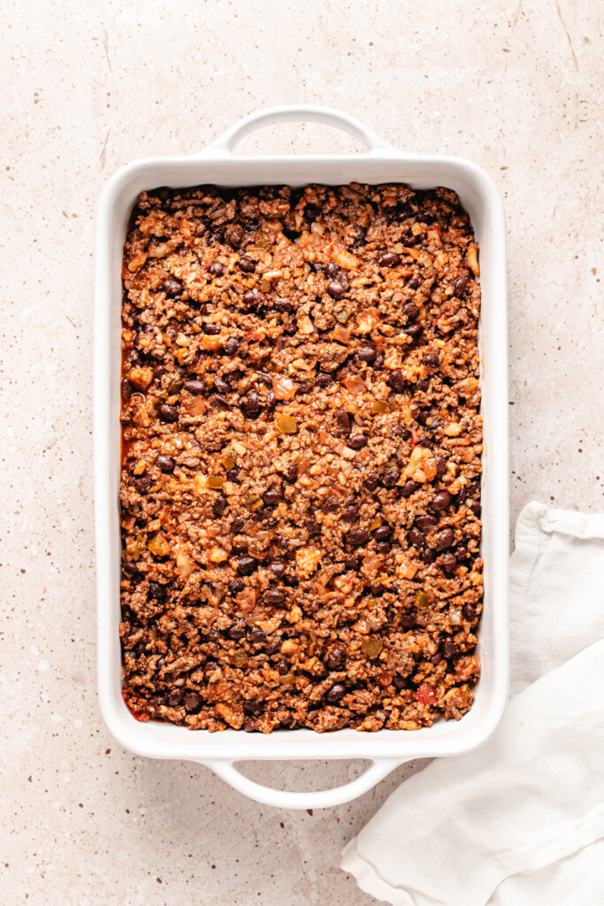 ground venison taco meat in casserole dish.