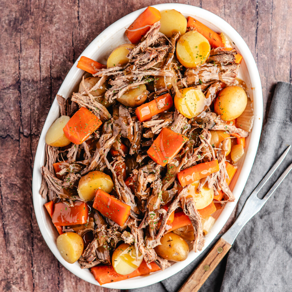 Venison roast shredded and served with carrots, potatoes, onions and gravy